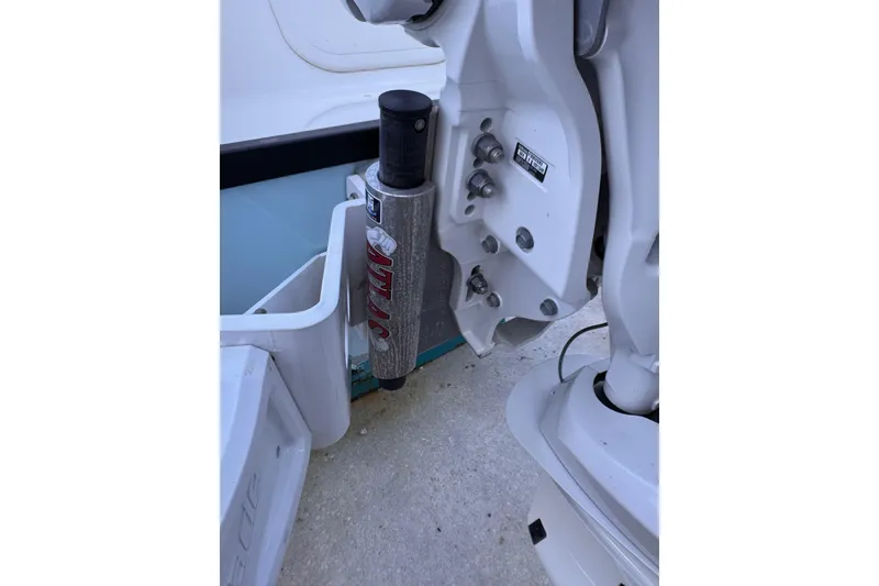 Slide: The Image of 2024 Pathfinder 2500 Hybrid boat engine mount detail with hydraulic components. - 13