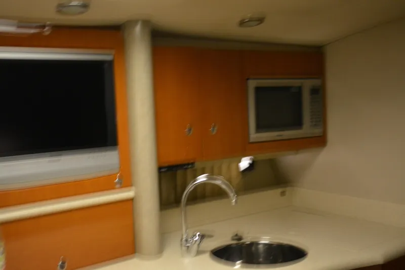 Slide: The Image of 2006 Formula 40 Performance Cruiser interior with white seating and cup holders. - 14