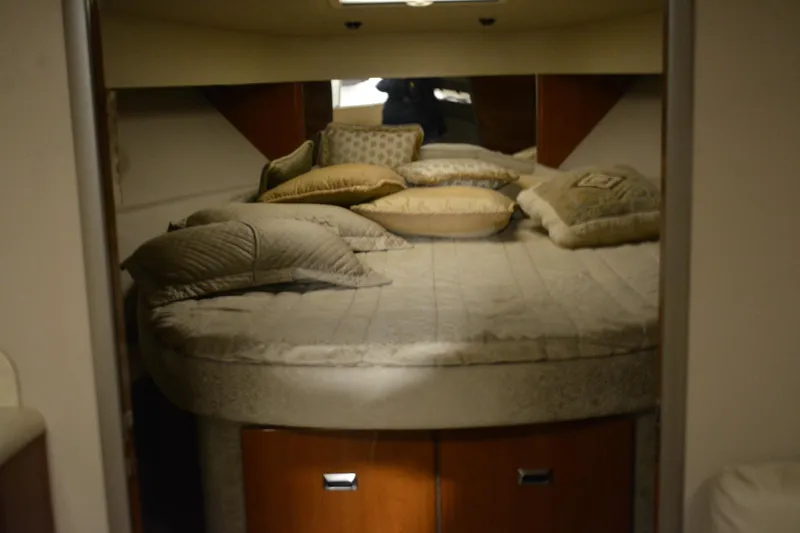 Slide: The Image of 2006 Formula 40 Performance Cruiser interior with beige seating and wooden table. - 15