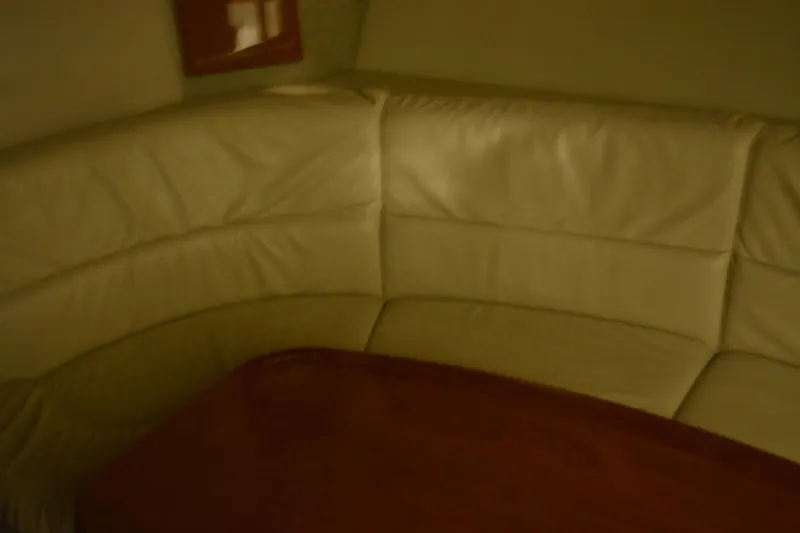 Slide: The Image of Interior of 2006 Formula 40 Performance Cruiser with leather seating and wooden cabinetry. - 16