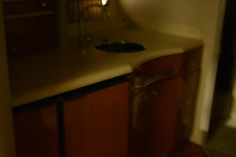 Slide: The Image of 2006 Formula 40 Performance Cruiser interior with TV, microwave, and sink. - 18