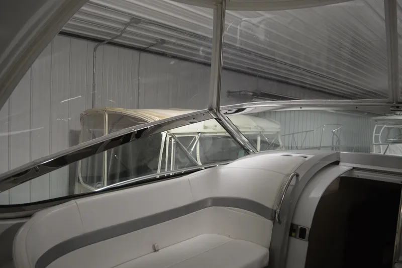 Slide: The Image of 2006 Formula 40 Performance Cruiser, sleek hull design in a showroom setting. - 2