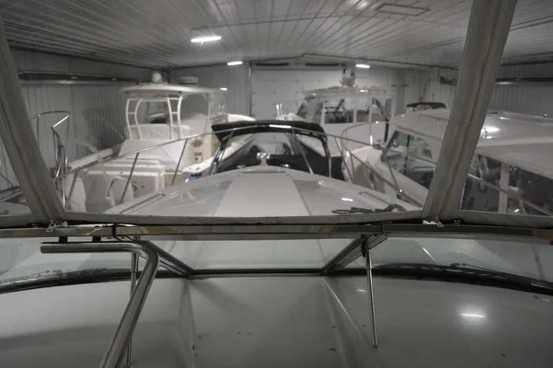 Slide: The Image of 2006 Formula 40 Performance Cruiser, sleek black hull with oval window detail. - 3