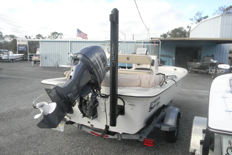 Slide: The Image of 2024 Carolina Skiff e-18 boat with Yamaha outboard motor on trailer. - 8