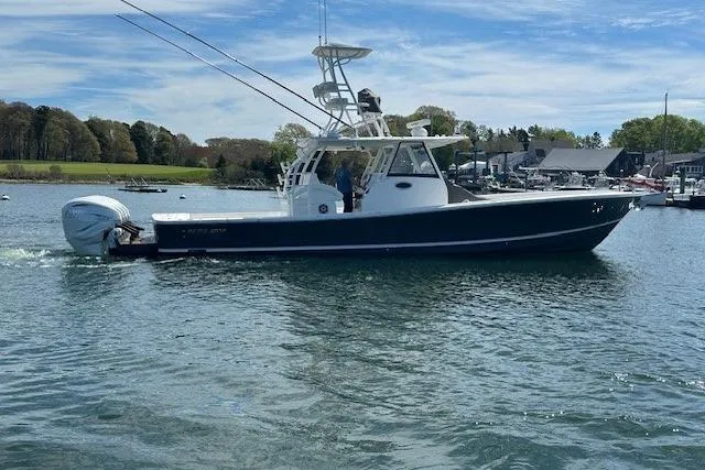 The Image of 2022 Regulator 41 boat on calm water with scenic background. - 0