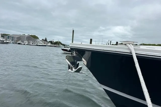 Slide: The Image of 2022 Regulator 41 boat anchored in a marina with cloudy skies. - 12