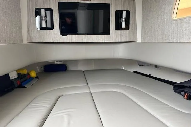 Slide: The Image of 2022 Regulator 41 cabin interior with bed, TV, and storage compartments. - 17