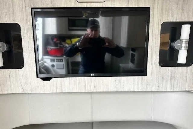 Slide: The Image of 2022 Regulator 41 interior with wall-mounted LG TV and modern decor. - 19