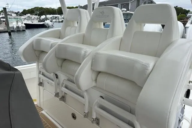 Slide: The Image of Luxury seating on 2022 Regulator 41 boat, docked at marina. - 25