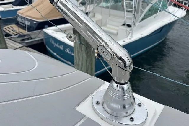 Slide: The Image of Chrome boat fitting on 2022 Regulator 41, docked near other vessels. - 28