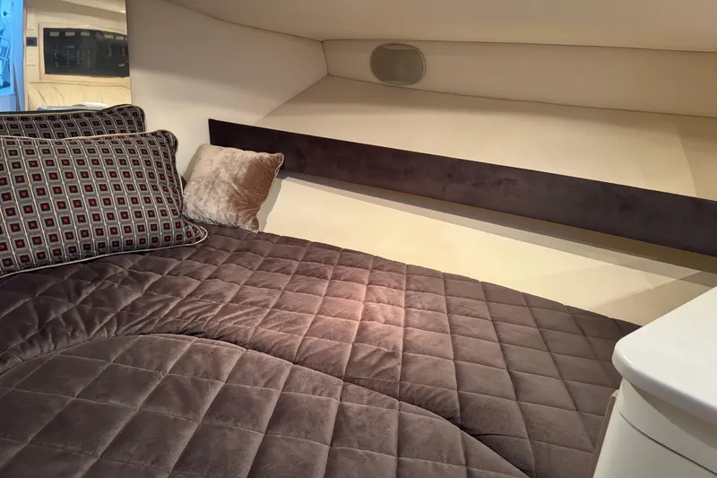 Slide: The Image of Cozy cabin interior of 1993 Blackfin 38 Combi with plush bedding and decorative pillows. - 11