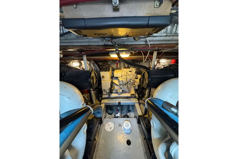 Slide: The Image of Engine room of a 1993 Blackfin 38 Combi boat, showcasing mechanical components. - 14