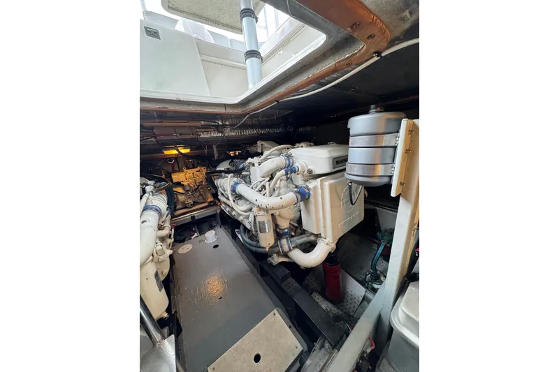 Slide: The Image of Engine room of a 1993 Blackfin 38 Combi boat, showcasing marine engine components. - 15