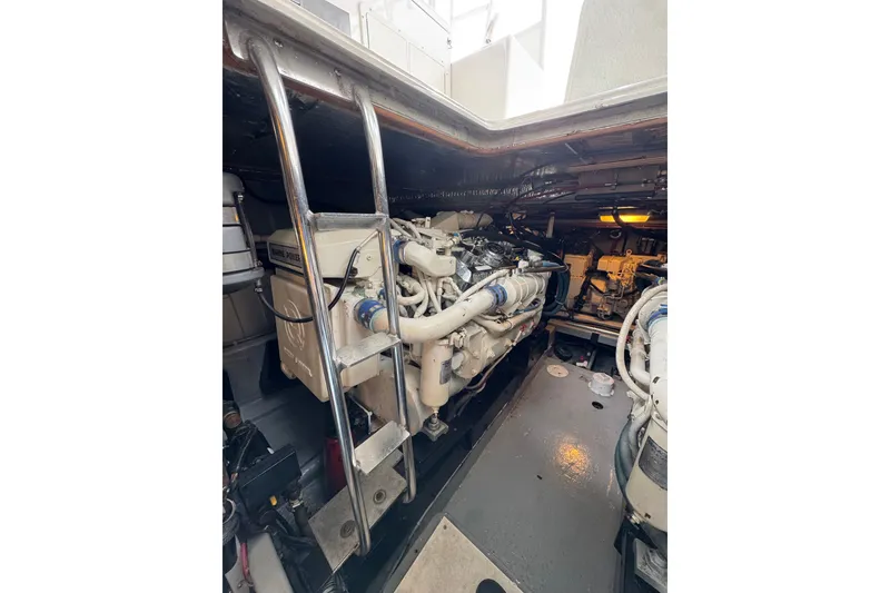 Slide: The Image of Engine room of a 1993 Blackfin 38 Combi boat, showcasing machinery and equipment. - 16