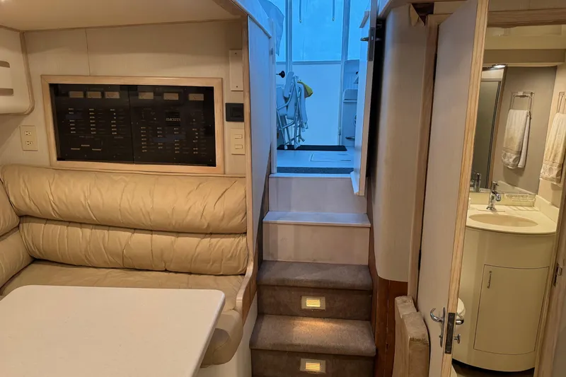 Slide: The Image of Interior of 1993 Blackfin 38 Combi yacht with seating, stairs, and bathroom. - 9