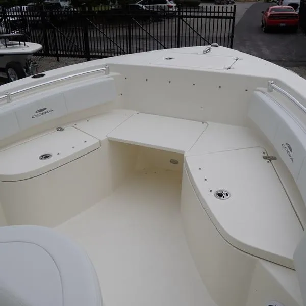 Slide: The Image of 2025 Cobia 220 Center Console boat interior with seating and storage compartments. - 5