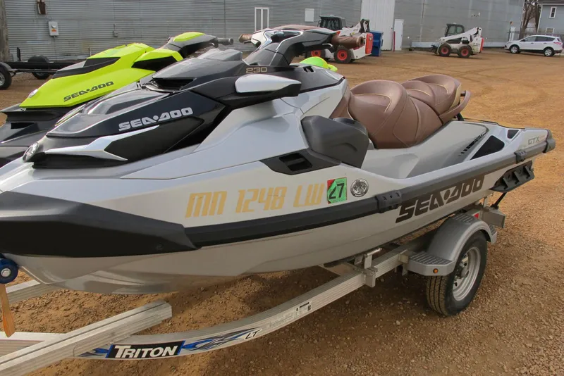 The Image of 2019 Sea-Doo GTX Limited 230 jet ski on trailer, parked outdoors. - 0