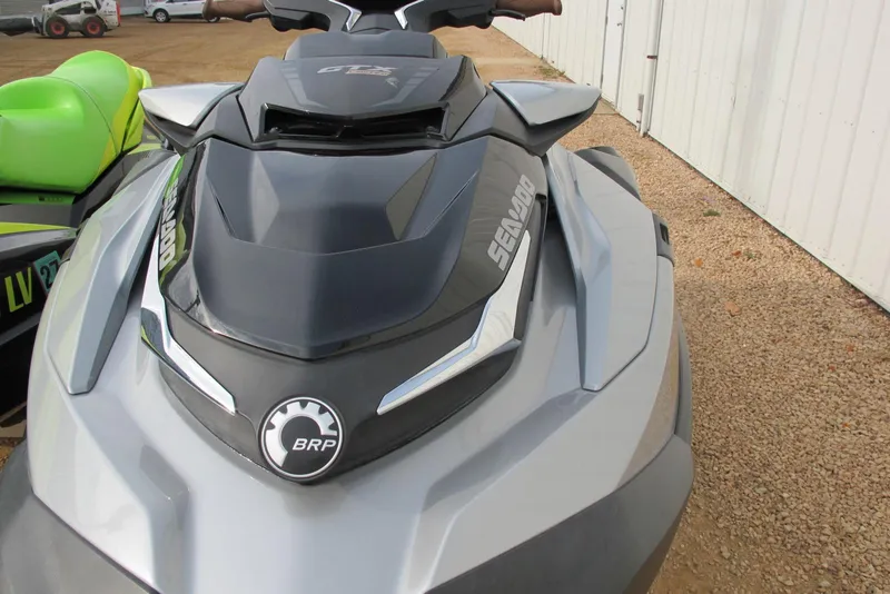 Slide: The Image of 2019 Sea-Doo GTX Limited 230 jet ski, gray and black, parked on gravel. - 3