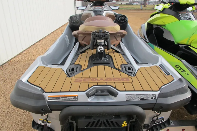 Slide: The Image of 2019 Sea-Doo GTX Limited 230 jet ski, rear view, parked on gravel. - 4