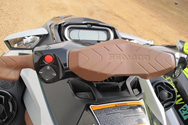 Slide: The Image of 2019 Sea-Doo GTX Limited 230 handlebars and controls, featuring ergonomic design and branding. - 6