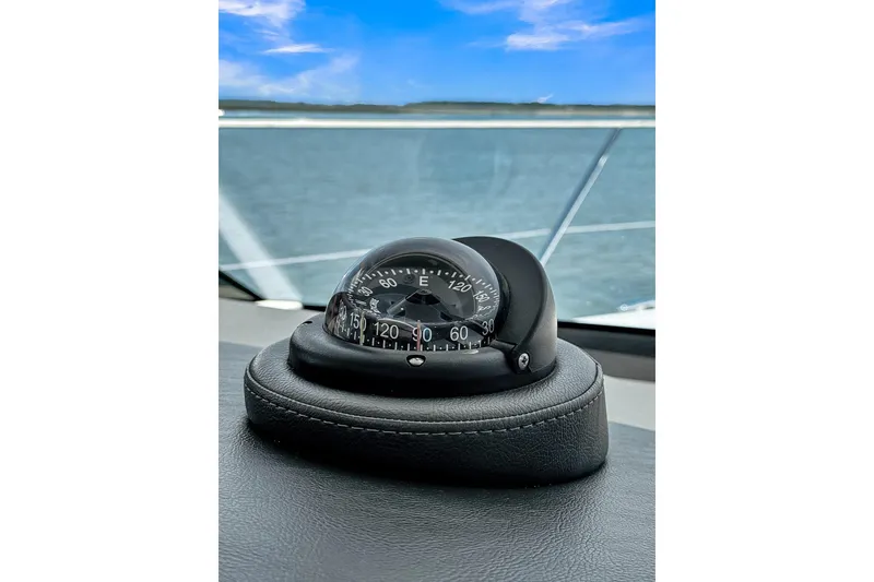 Slide: The Image of Compass on 2020 Riviera 4800 Sport Yacht dashboard with ocean view. - 30