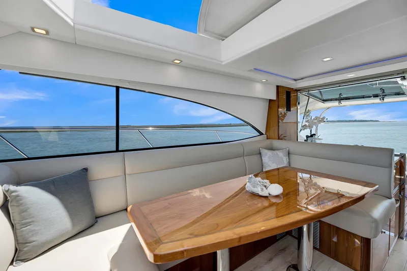 Slide: The Image of Luxurious interior of 2020 Riviera 4800 Sport Yacht with elegant seating and ocean view. - 40