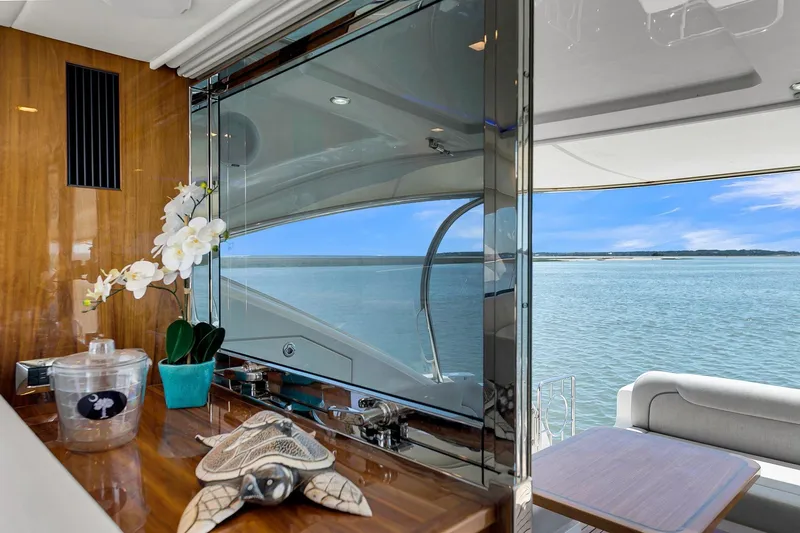 Slide: The Image of Luxurious interior of 2020 Riviera 4800 Sport Yacht with ocean view and elegant decor. - 41