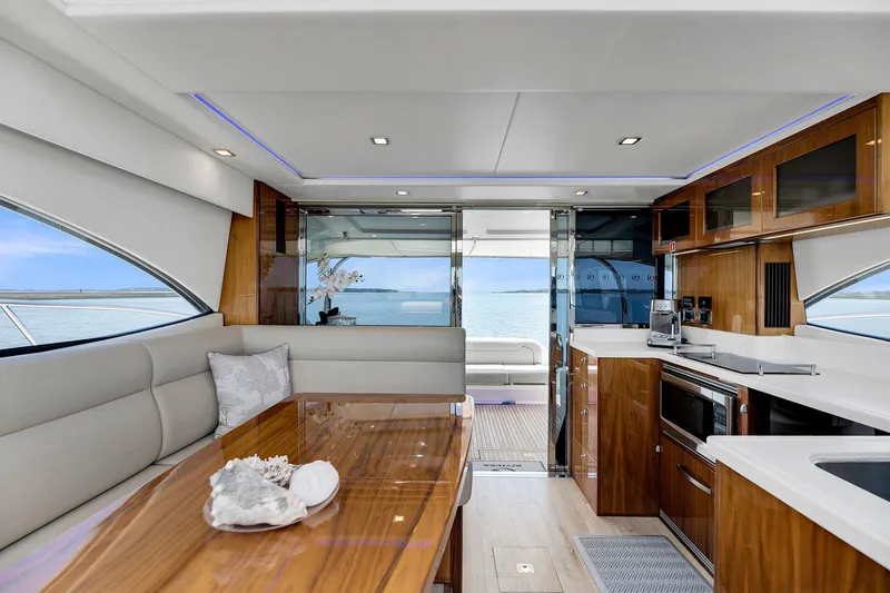 Slide: The Image of Luxurious interior of 2020 Riviera 4800 Sport Yacht with modern kitchen and ocean view. - 42