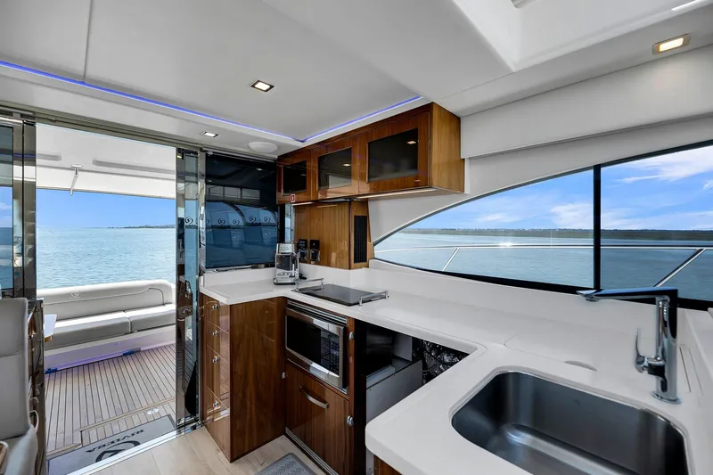 Slide: The Image of Luxurious interior of 2020 Riviera 4800 Sport Yacht with modern kitchen and ocean view. - 43