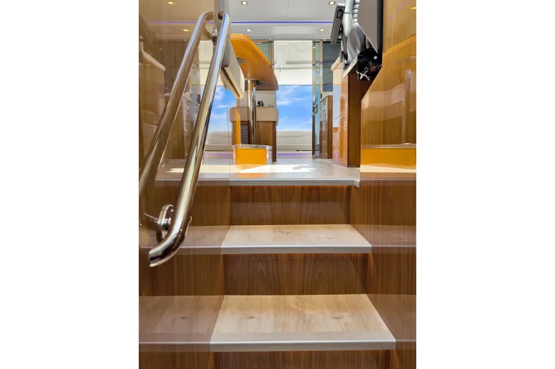Slide: The Image of Staircase leading to the interior of a 2020 Riviera 4800 Sport Yacht. - 45