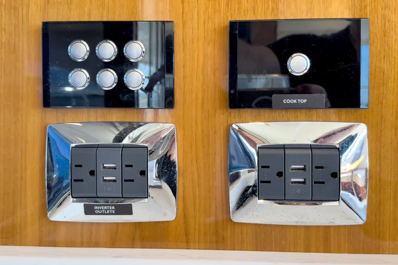 Slide: The Image of Control panel and outlets on 2020 Riviera 4800 Sport Yacht interior. - 55
