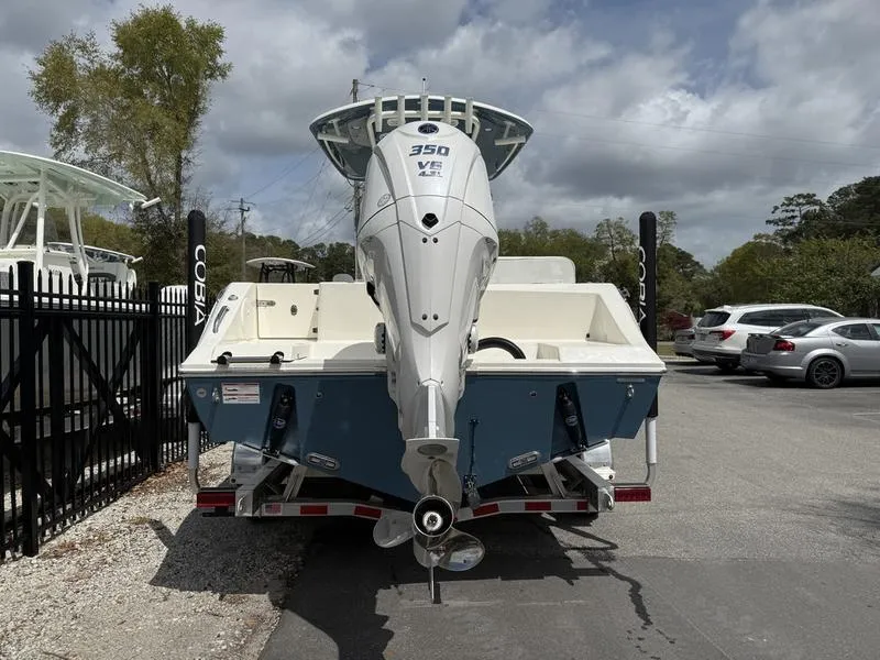 Slide: The Image of 2025 Cobia 240 Center Console boat with 350 HP engine, parked outdoors. - 4