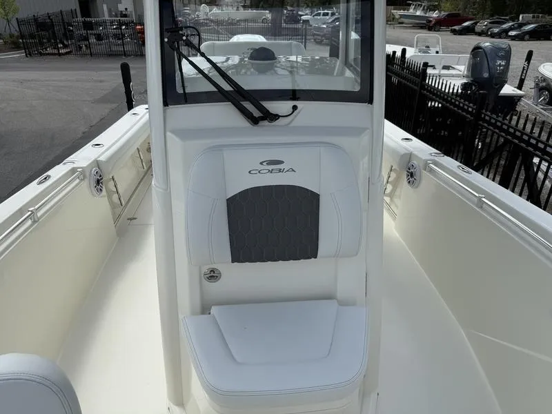 Slide: The Image of 2025 Cobia 240 Center Console boat interior with seating and windshield. - 7