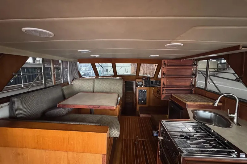 Slide: The Image of Interior of a 1990 Symbol 53 Sedan yacht with dining area and kitchen. - 7