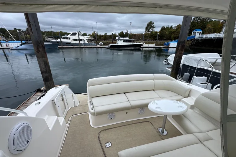 Slide: The Image of 2008 Tiara Yachts 3900 Sovran with spacious seating at a marina. - 15