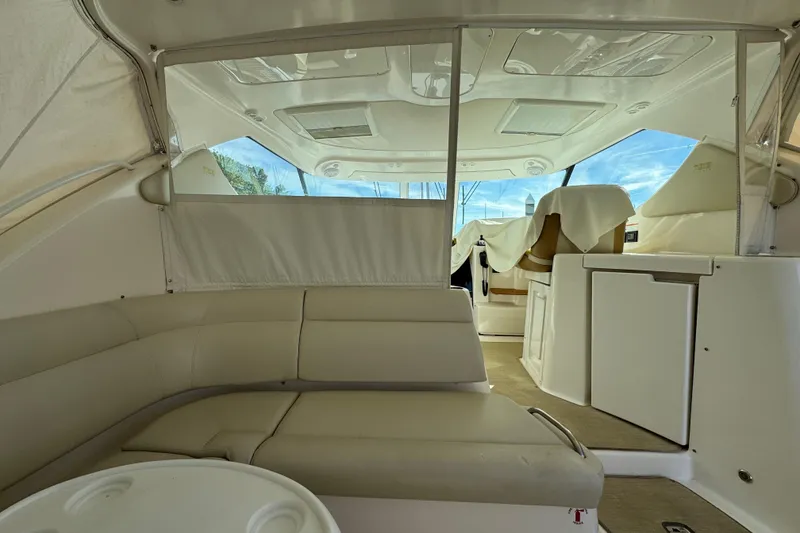 Slide: The Image of 2008 Tiara Yachts 3900 Sovran interior with beige seating and modern amenities. - 16