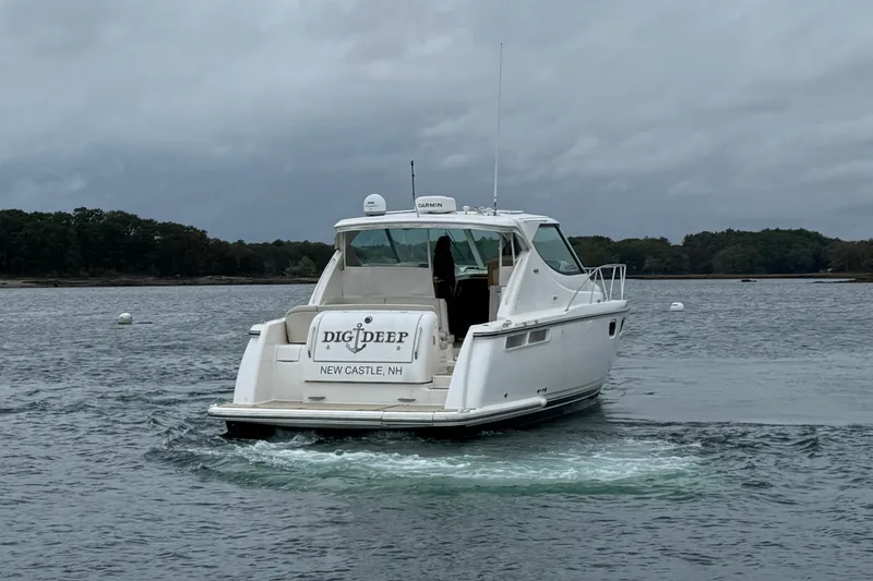 Slide: The Image of 2008 Tiara Yachts 3900 Sovran cruising on a calm, overcast waterway. - 2