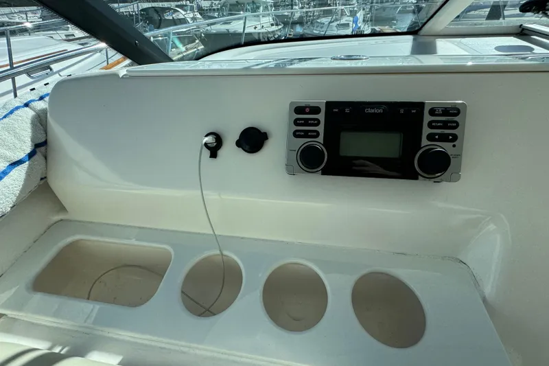 Slide: The Image of 2008 Tiara Yachts 3900 Sovran dashboard with Clarion stereo system and cup holders. - 22
