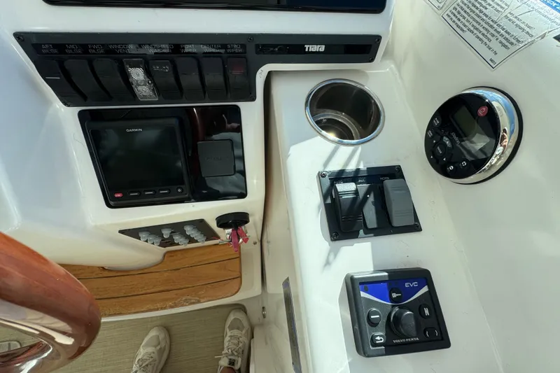 Slide: The Image of 2008 Tiara Yachts 3900 Sovran dashboard with controls, Garmin display, and cup holder. - 30
