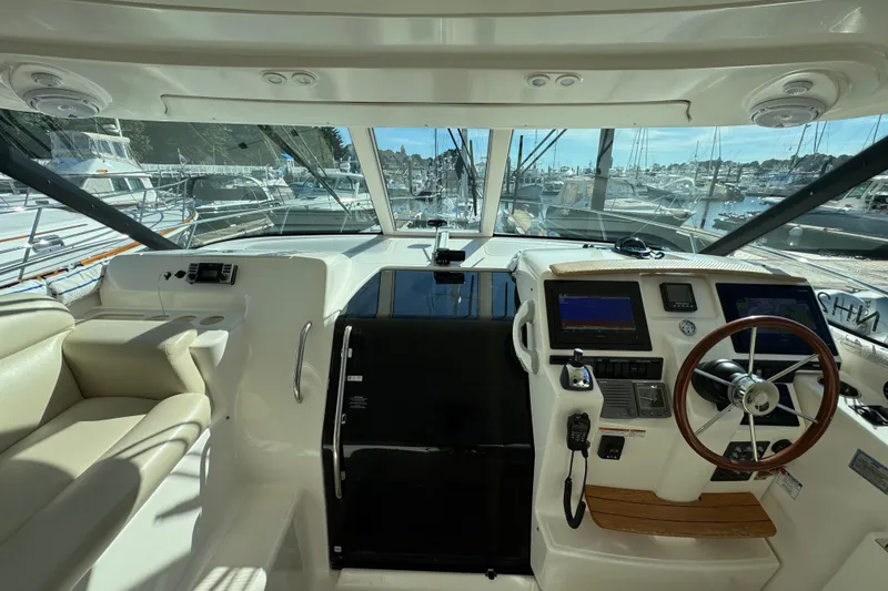 Slide: The Image of 2008 Tiara Yachts 3900 Sovran helm with steering wheel and navigation displays. - 36