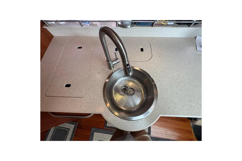 Slide: The Image of 2008 Tiara Yachts 3900 Sovran kitchen sink with modern faucet and countertop. - 41