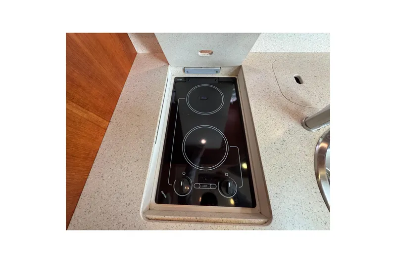 Slide: The Image of 2008 Tiara Yachts 3900 Sovran kitchen with sleek electric cooktop. - 42