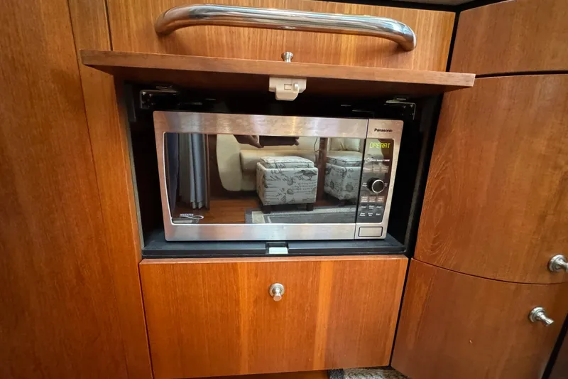 Slide: The Image of Built-in microwave in 2008 Tiara Yachts 3900 Sovran, wooden cabinetry. - 44