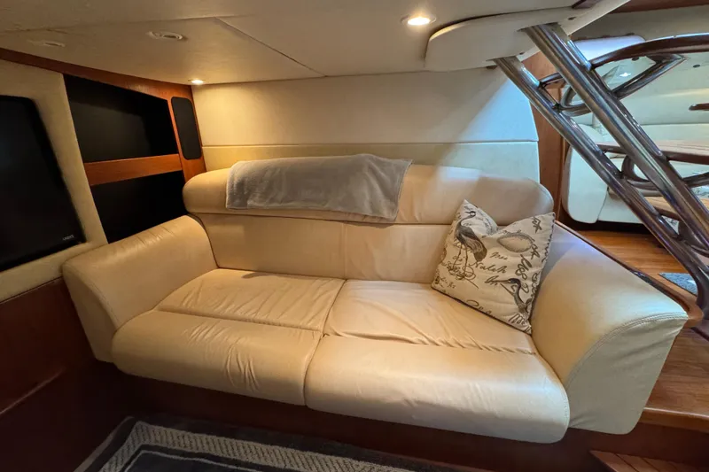 Slide: The Image of Luxurious interior of 2008 Tiara Yachts 3900 Sovran with beige leather sofa and decorative pillow. - 46