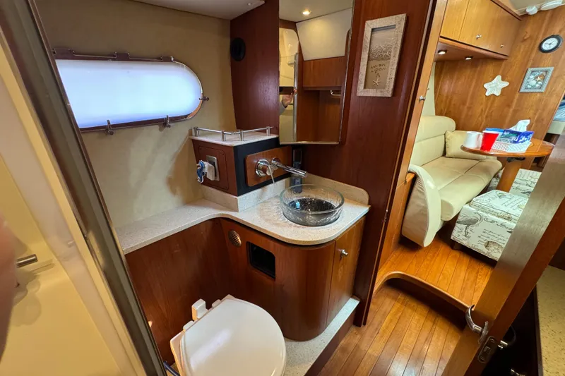Slide: The Image of 2008 Tiara Yachts 3900 Sovran interior with bathroom and cozy seating area. - 56