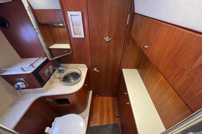 Slide: The Image of Luxurious 2008 Tiara Yachts 3900 Sovran bathroom with wood cabinetry and modern fixtures. - 57