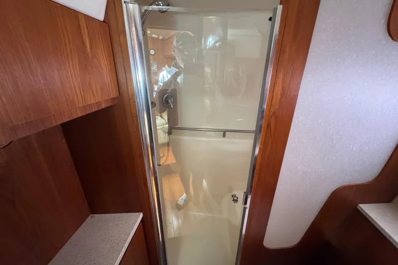 Slide: The Image of Interior of 2008 Tiara Yachts 3900 Sovran, featuring a compact shower area. - 59