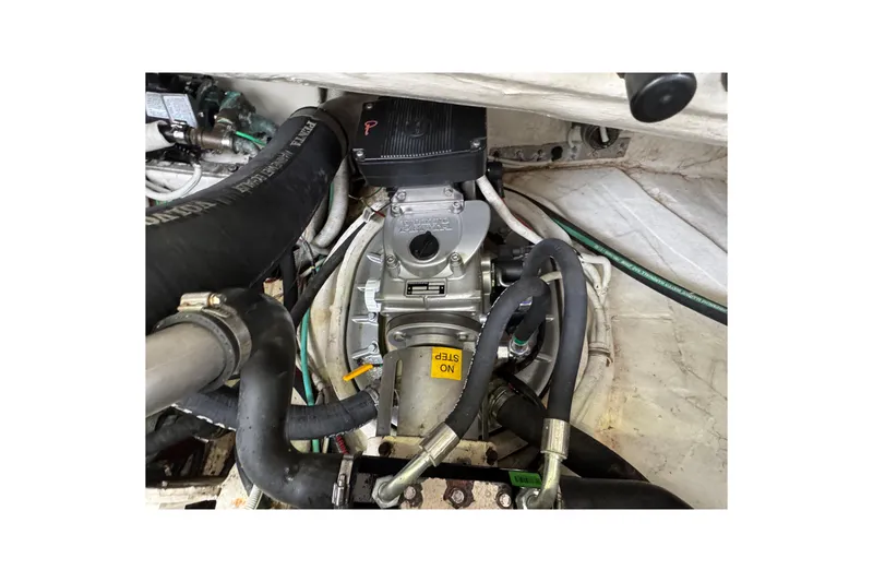 Slide: The Image of Engine compartment of 2008 Tiara Yachts 3900 Sovran with visible hoses and components. - 65