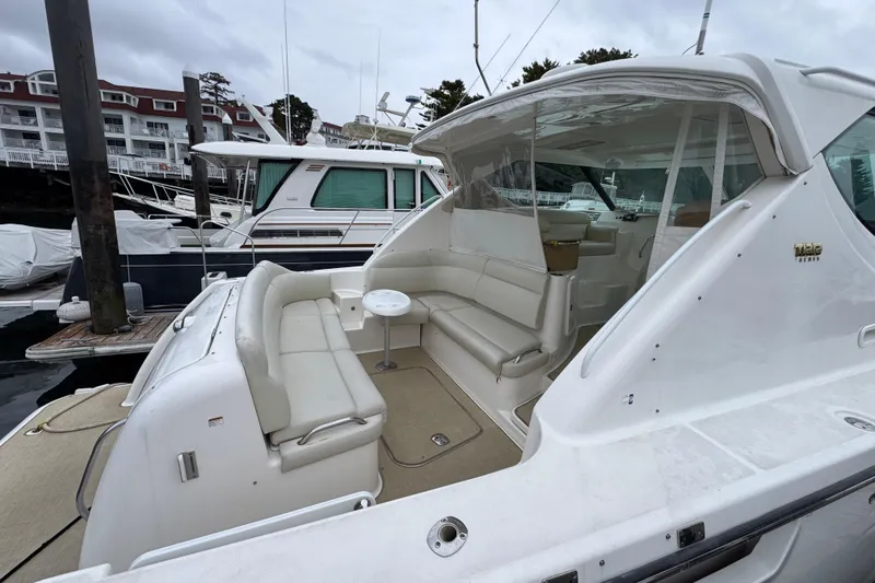 Slide: The Image of 2008 Tiara Yachts 3900 Sovran with spacious seating at a marina dock. - 7
