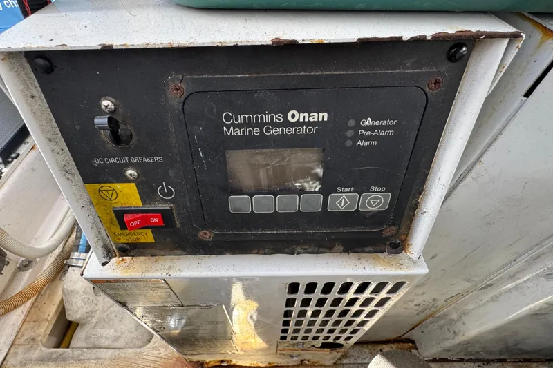 Slide: The Image of Control panel of Cummins Onan marine generator on 2008 Tiara Yachts 3900 Sovran. - 70